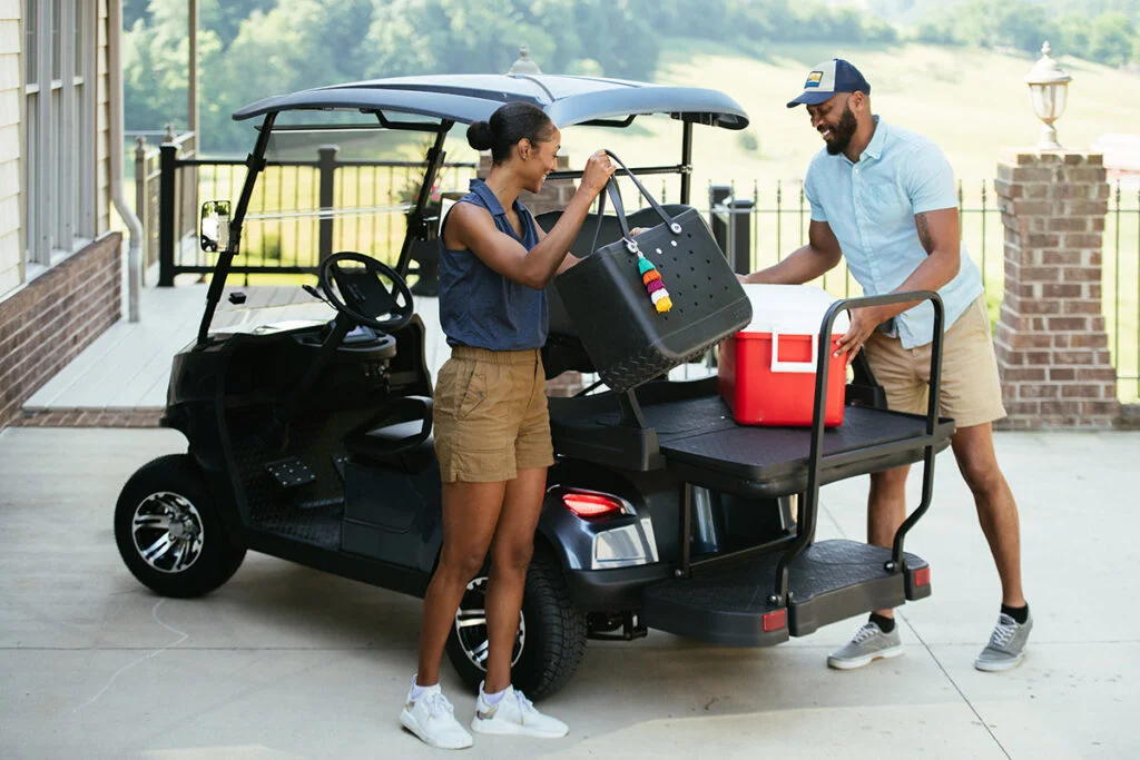 Golf cart packing for a trip to the pool in the country